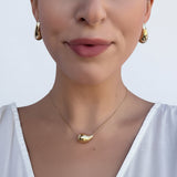 Necklace with thin silver chain and teardrop pendant